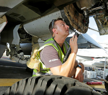 Person inspecting aircraft