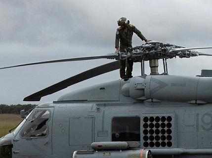 Person inspecting helicopter
